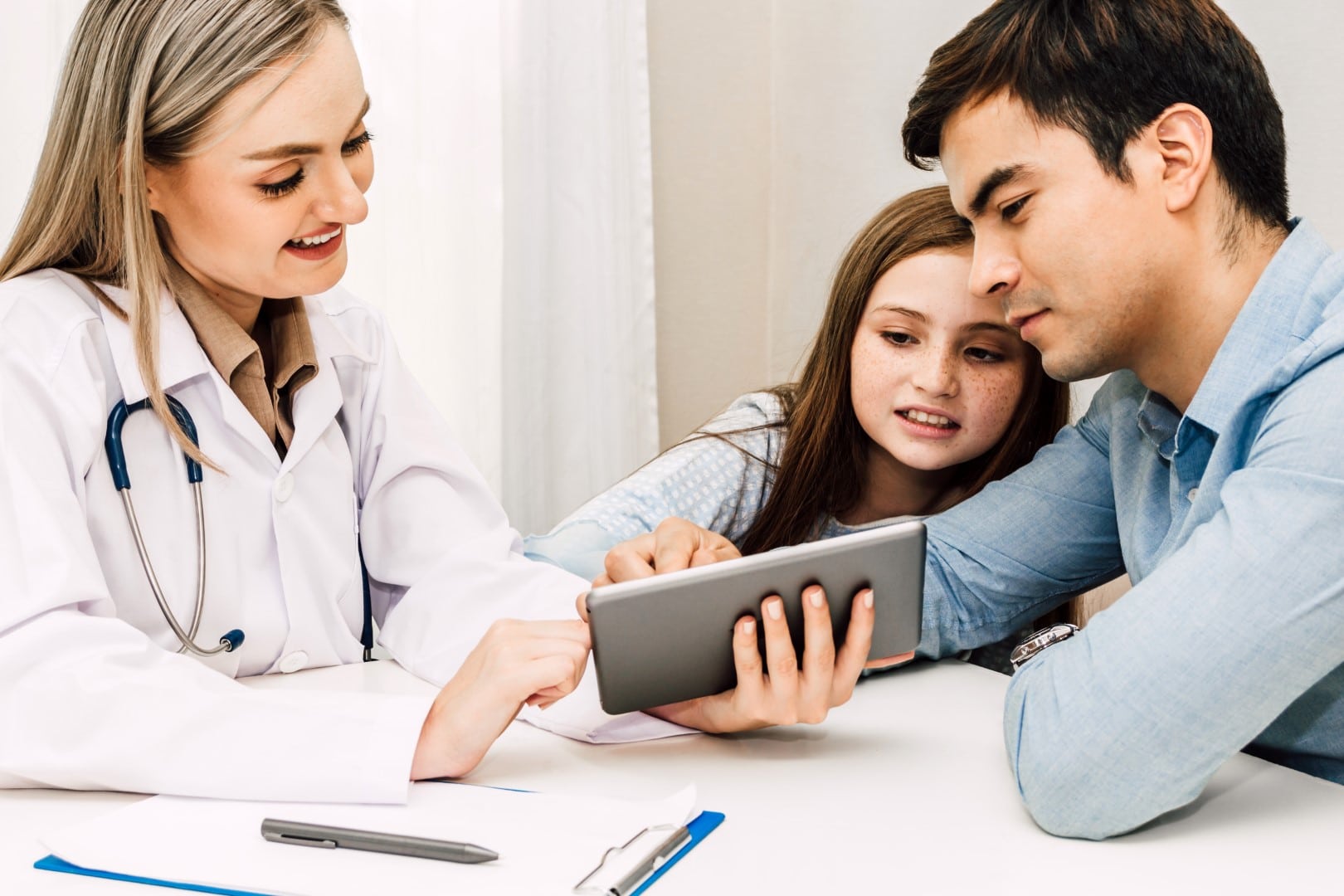 A doctor consulting a father and his daughter who needs focused care for their ADHD/ADD needs A doctor consulting a father and his daughter who needs focused care for their ADHD/ADD needs