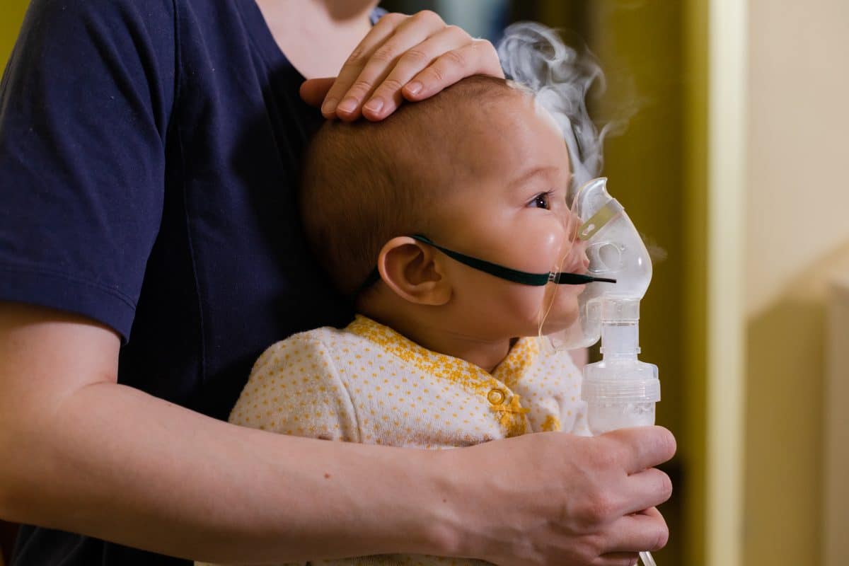 baby using a nebulizer for asthma